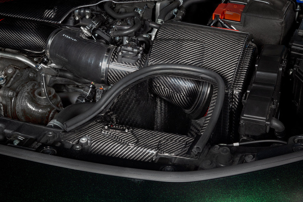 Carbon fiber air intake box with curved tubes installed in Honda Civic Type R engine bay - Eventuri air intake for Honda Civic Type R