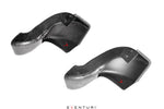 Two curved carbon fiber intake scoops with glossy finish, showing mounting holes and aerodynamic design - Eventuri intake scoop for BMW M3