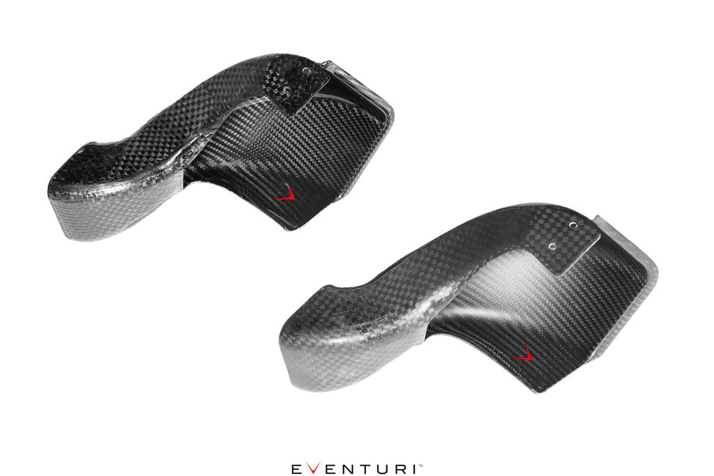 Two curved carbon fiber intake scoops with glossy finish and mounting holes on clean white background - Eventuri intake scoop for BMW M3