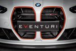 Black carbon fiber intake scoop installed in front grille opening with angular design and visible mounting hardware - Eventuri intake scoop for BMW M3