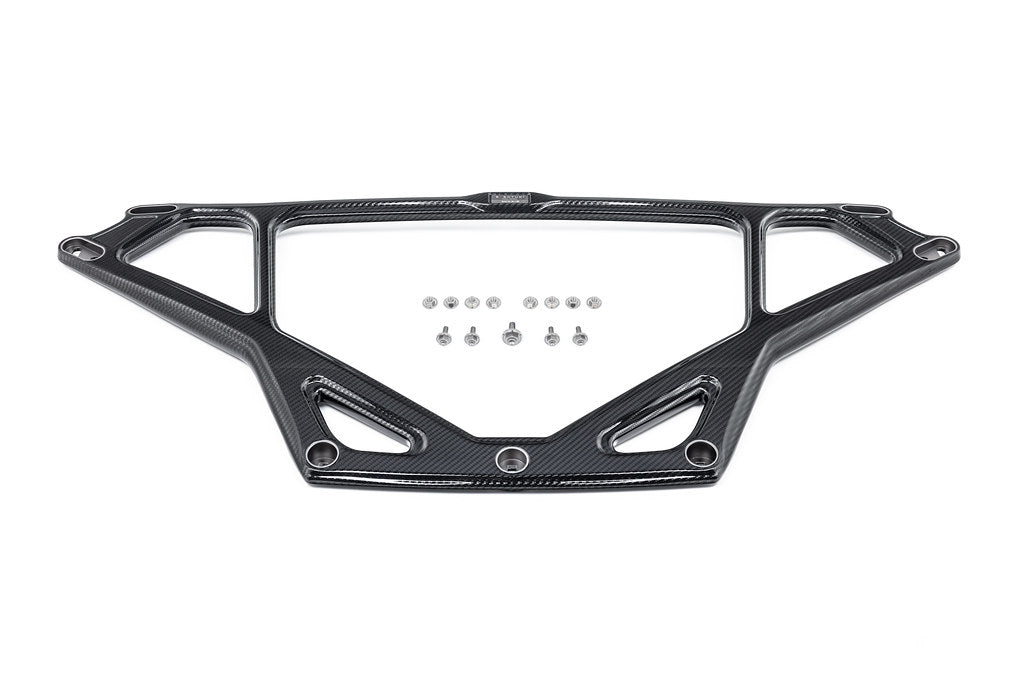 Black carbon fiber strut tower brace with triangular design and mounting hardware bolts displayed separately - Eventuri strut brace for BMW M2