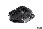 Black carbon fiber engine cover with angular geometric design and integrated air intake openings - Eventuri engine cover for BMW M2