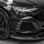 A close up view of a car fitted with Urban Automotive Carbon Fiber Front Eyebrows Kit Audi RSQ8 2020+