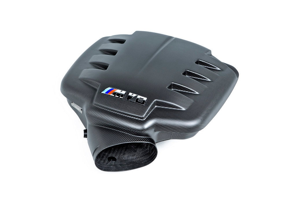 Carbon fiber inlet plenum with curved aerodynamic design featuring air intake openings and circular outlet port - Eventuri inlet plenum for BMW M3
