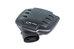 Carbon fiber inlet plenum with curved aerodynamic design featuring air intake openings and circular outlet port - Eventuri inlet plenum for BMW M3