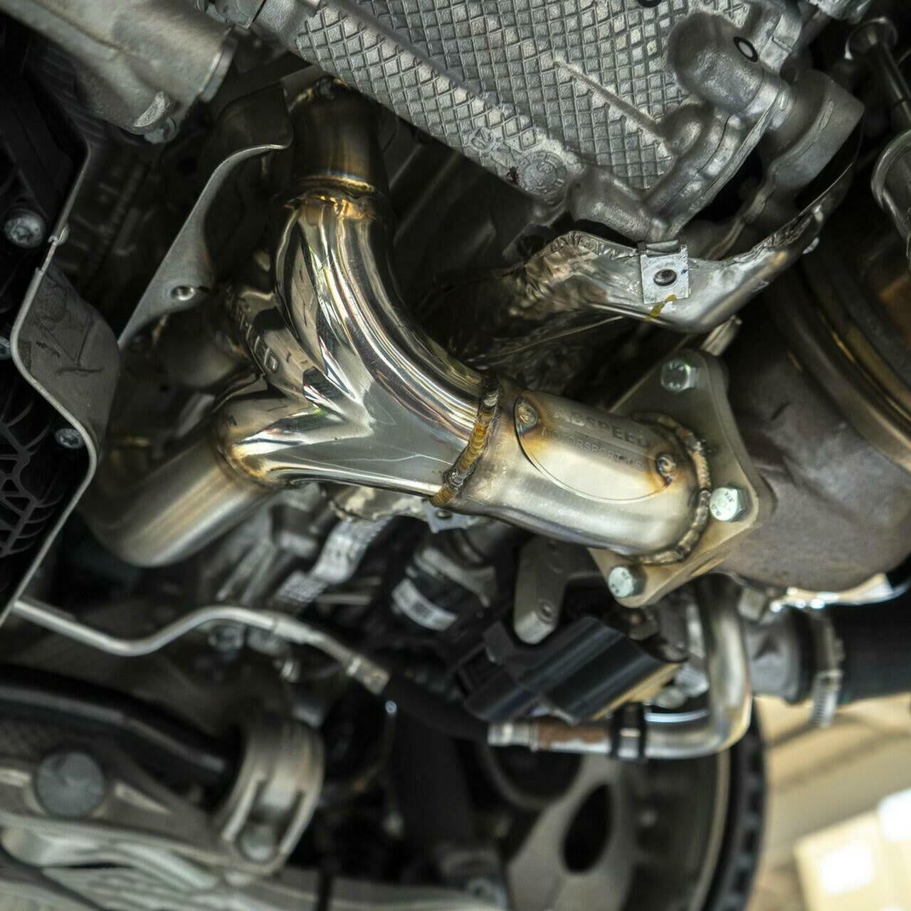 992 Carrera sport header installed under the engine