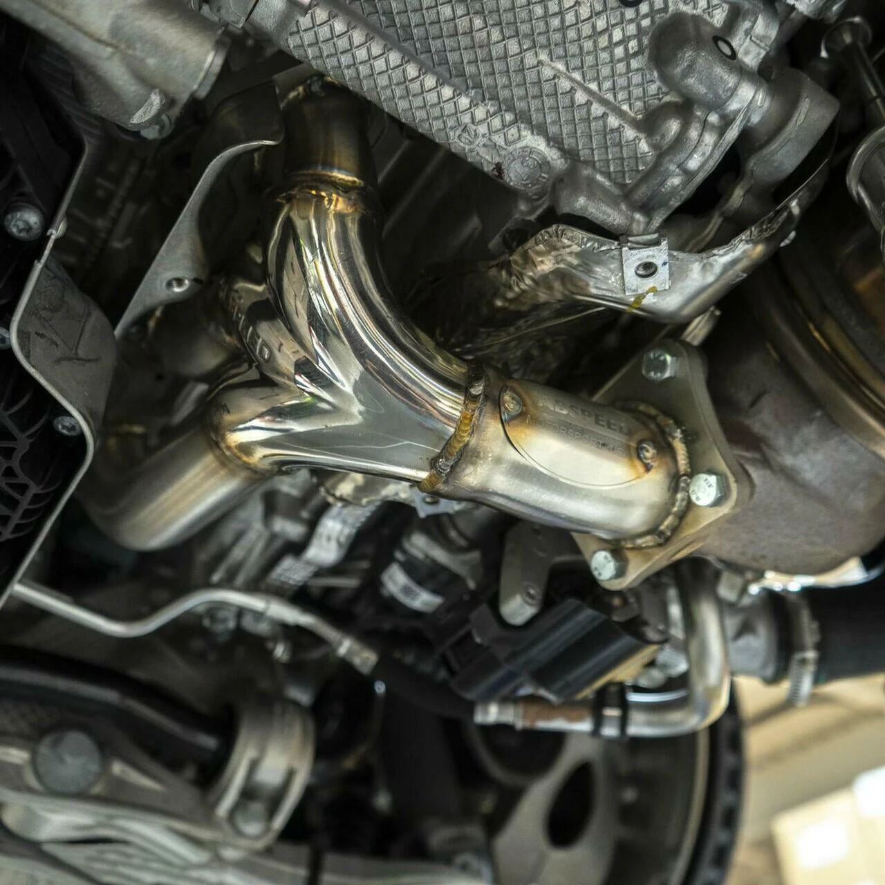992.2 Carrera sport header installed under the engine