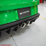 Rear of a green Porsche 992 GT3 with the Fabspeed cat-back tips