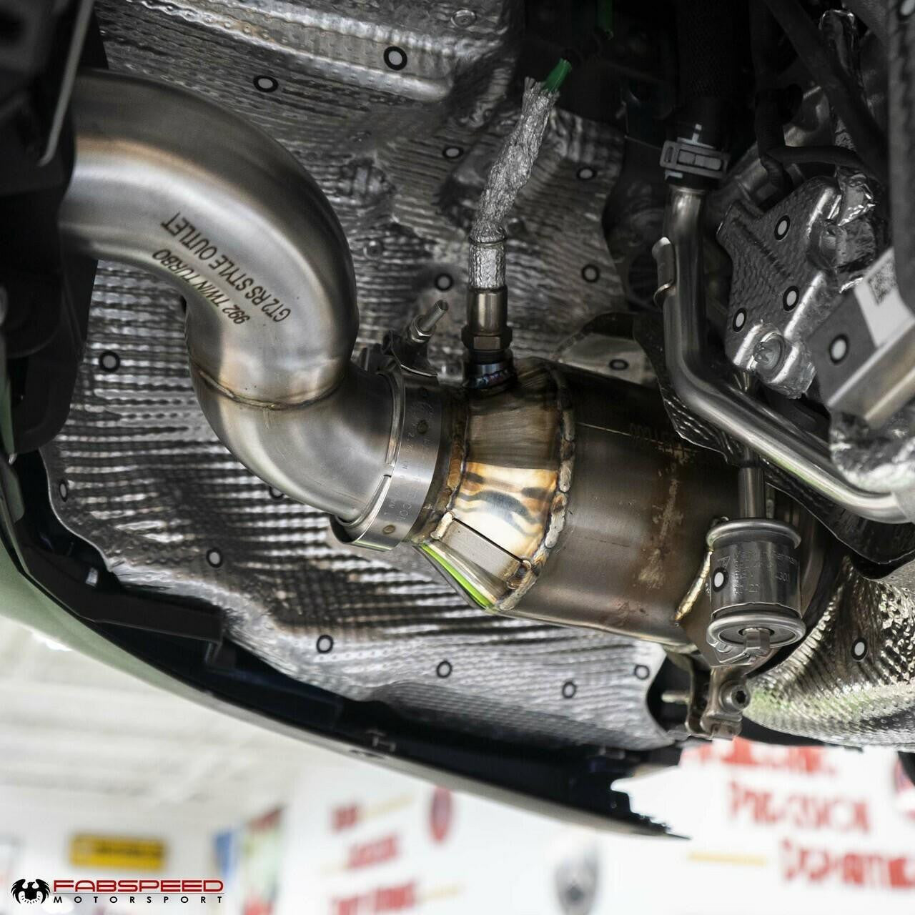 Installed 992.2 GT2RS-style sport cat beside the engine