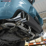 Quad tips of the 997.2 valved exhaust on a blue Porsche 911