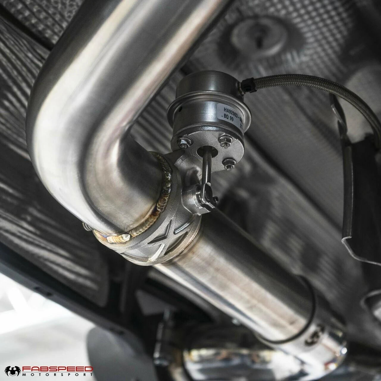 Fabspeed 718 valved exhaust pipe routing near the rear subframe
