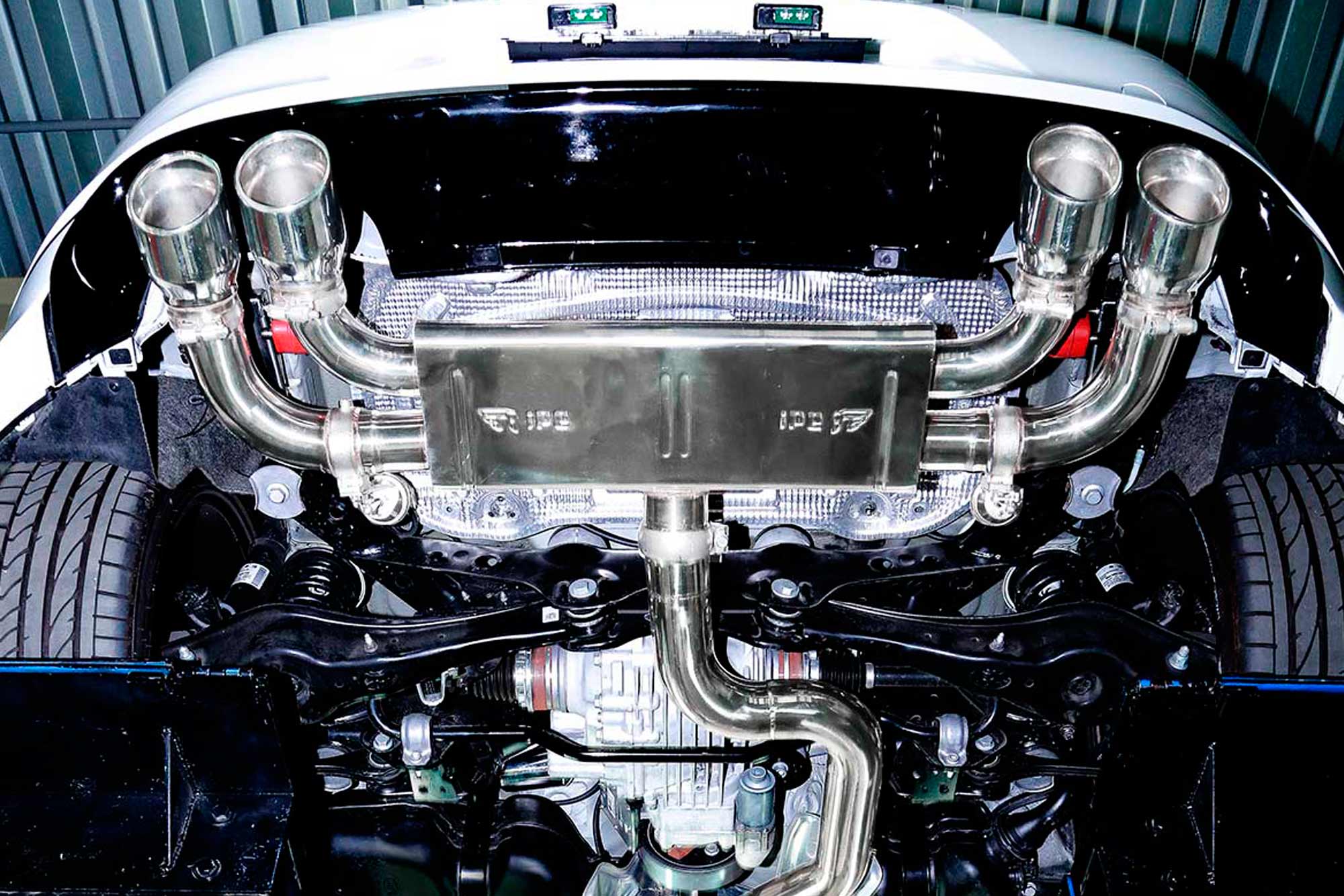 Underside view of the IPE exhaust installed on a Volkswagen Golf R Mk7.5 with quad tips