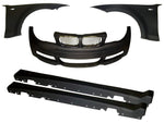 A front view of Evolution Racewerks FE (Front End) Widebody Kit (BMW 1 Series) for 135i/128i showing FE Widebody 5 piece kit: Front bumper, x2 fender, x2 side skirts (dry vacuum carbon fiber version shown).  Kidney grills shown not included.