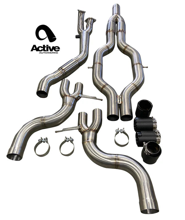 Wide shot of Active Autowerke RACE ONLY Exhaust System - GOLIATH for BMW G80/G82 M3/M4 Signature with tips with white background