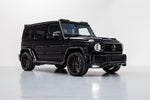 A side wide view of a black g wagon fitted with Urban Automotive Full Widetrack Lower Styling Program Mercedes-Benz G Wagon 2018+