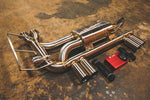 A side overview of Valvetronic Designs Valved Sport Exhaust, with wires and a red box on the ground (for BMW E46 M3).