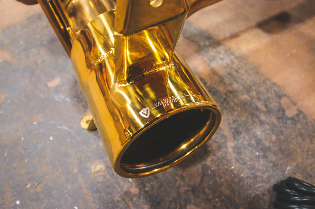 A close up view of a part of Valvetronic Designs Valved Sport Exhaust System on the ground (for Ferrari 488 GTB and Pista).