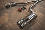A side overview of Valvetronic Designs Valved Sport Exhaust System on the ground (Alpina B6 / BMW 650i).