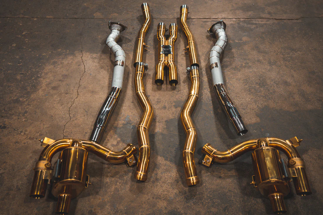 A top overview of Valvetronic Designs Ferrari Valved Exhaust system with free flow front pipes on the ground (for GTC4 Lusso).
