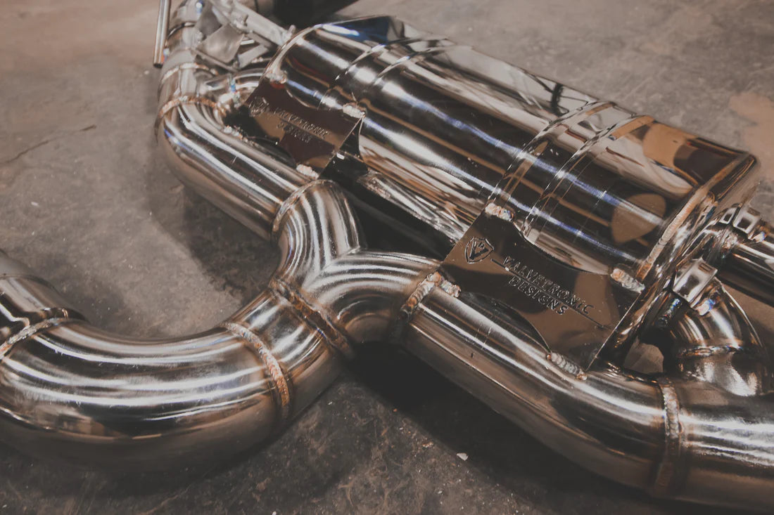 A close up view of a part of Valvetronic Designs Valved Sport Exhaust System (for Audi TTRS MK3) on the ground