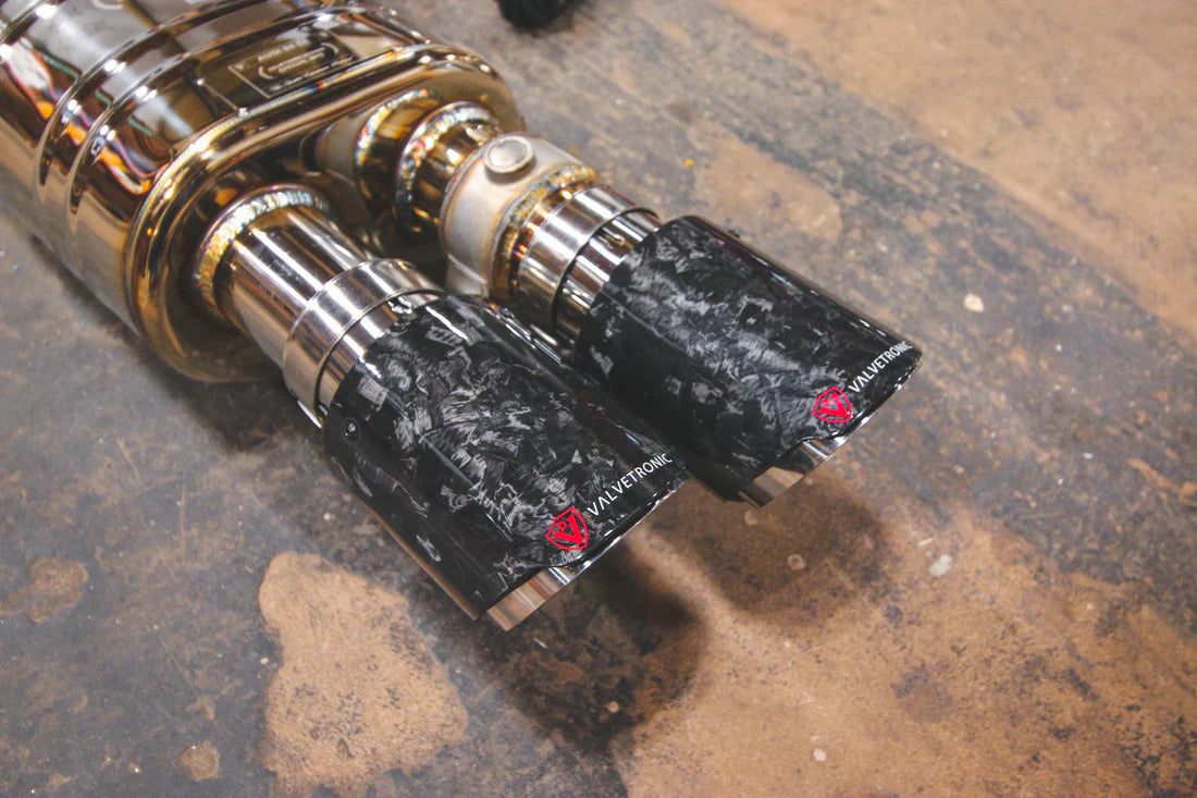 A close up of Valvetronic Designs Valved Sport Exhaust System (for Audi B8 / B8.5 S4 / S5) on the ground. 