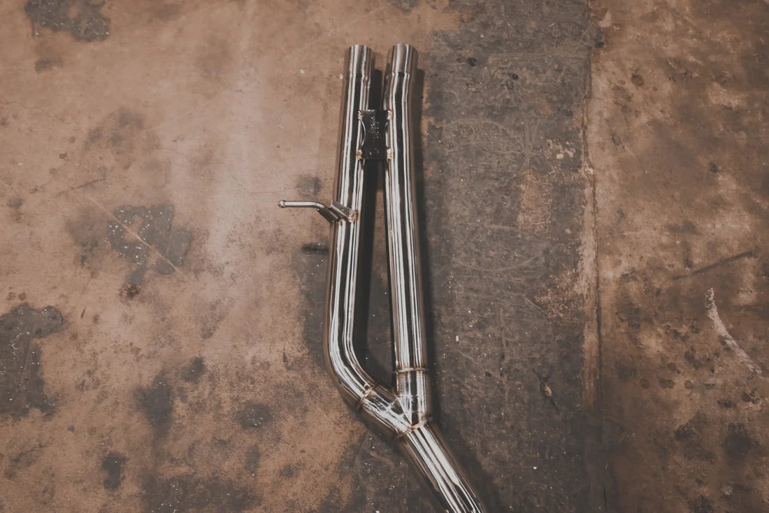 A wide overview of Valvetronic Designs Valved Sport Exhaust System pipes (for Audi TTRS MK3) on the ground