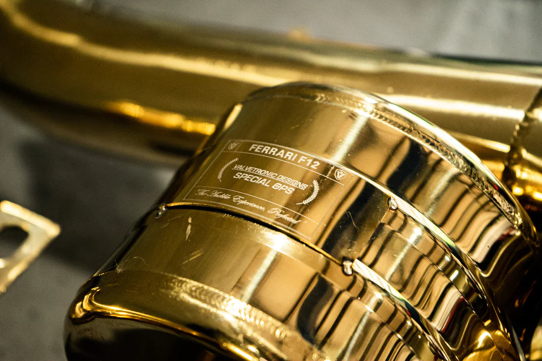 A close view of Valvetronic Designs Valved Sport Exhaust System's muffler on the ground (for Ferrari F12 / 812).