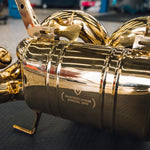 A close up of Valvetronic Designs Valved Sport Exhaust System's muffler on a grey carpet on the ground (for Lamborghini Aventador LP700 / SV).