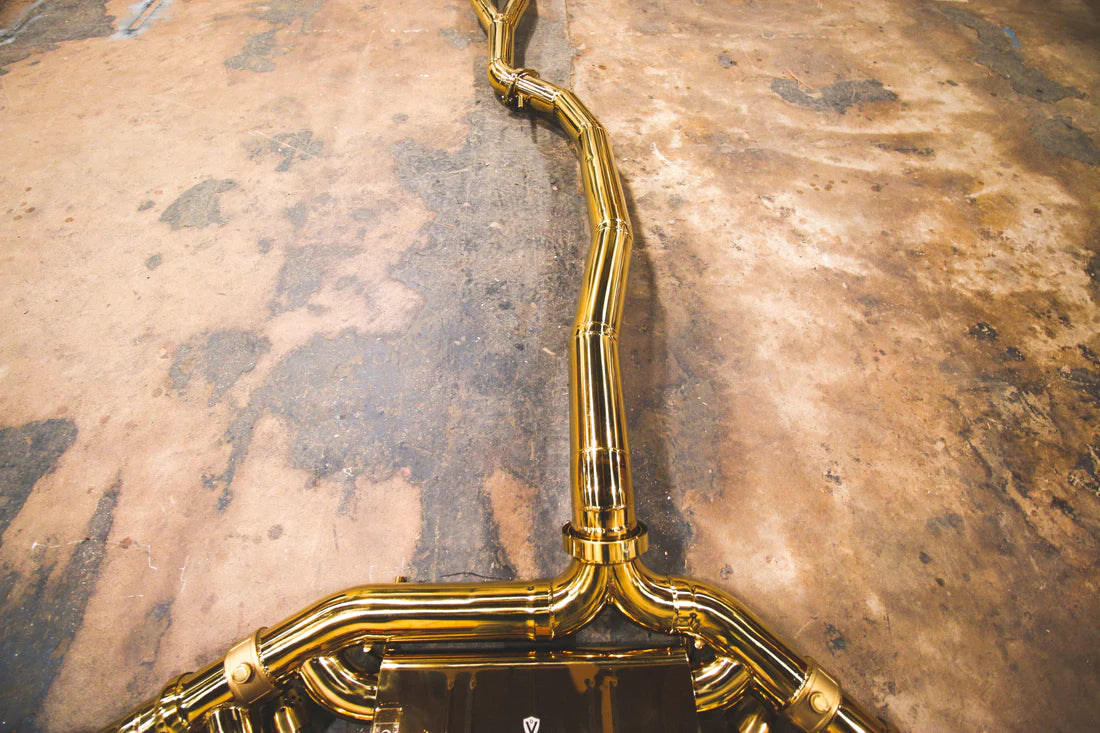 A top overview of Valvetronic Designs Valved Sport Exhaust System's pipes on the ground (for Nissan GTR R35).