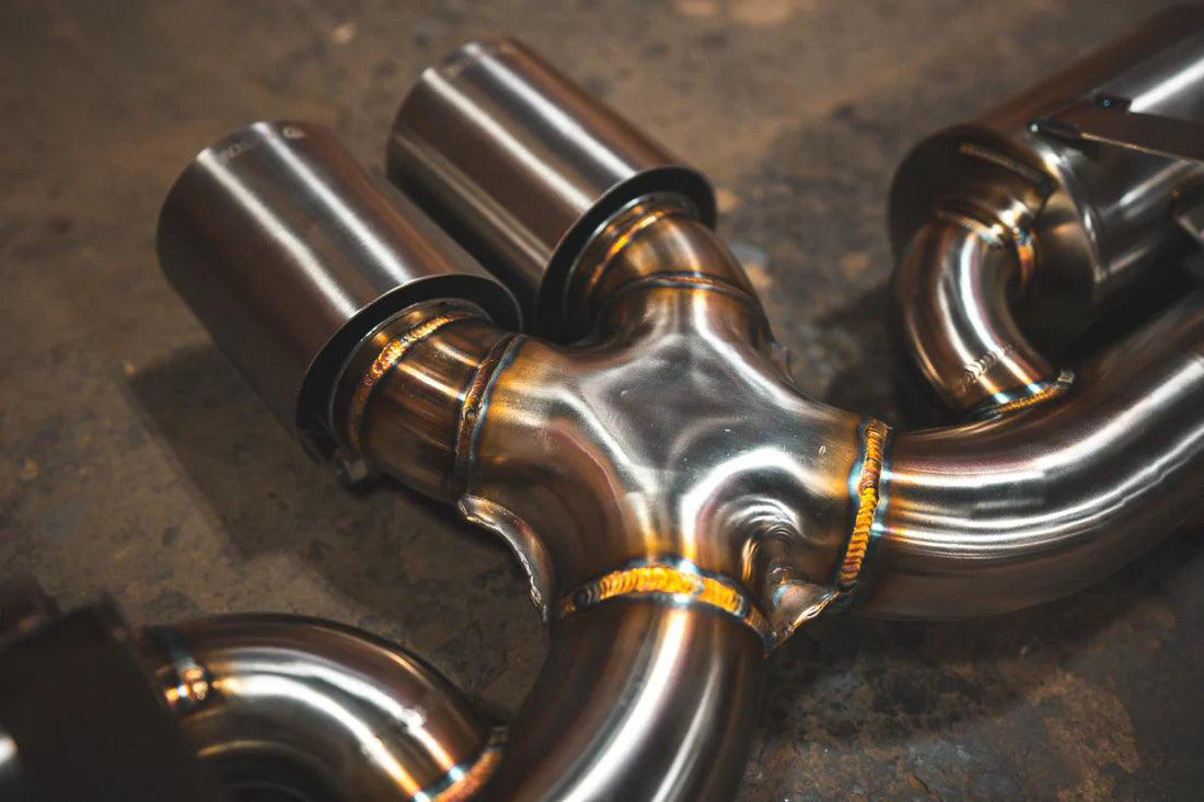 A close overview of Valvetronic Designs Valved Sport Exhaust System on the ground (for Porsche 992 GT3/ RS).