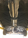 A wide view of Valvetronic Designs Valved Sport Exhaust System fitted on a car (for Mercedes CLA45).