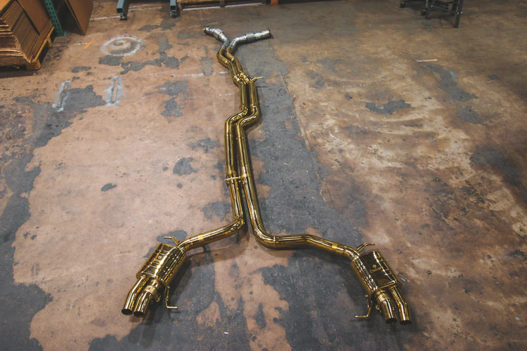 A top wide view of Valvetronic Designs Valved Sport Exhaust System (for Audi RS6 / RS7 C8) on the ground. 
