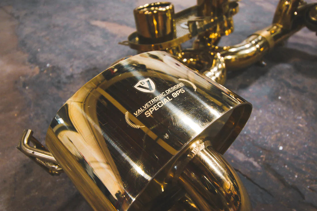 A close up view of Valvetronic Designs Valved Sport Exhaust System's muffler on the ground (for Ferrari 458 Italia).