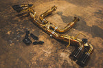A side overview of Valvetronic Designs Valved Sport Exhaust System on the ground (for Chevrolet Corvette C8).