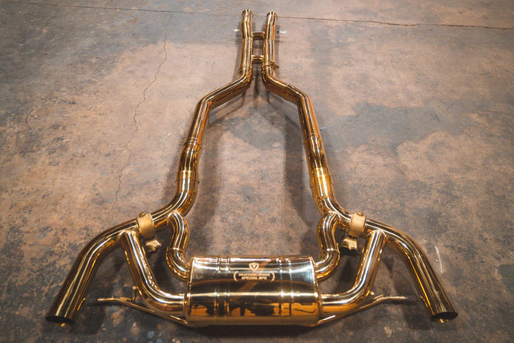 A top overview of Valvetronic Designs Valved Sport Exhaust system on the ground (for Mercedes AMG GT).