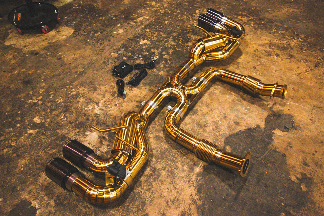 A side overview of Valvetronic Designs Valved Sport Exhaust System on the ground (for Chevrolet Corvette C8).