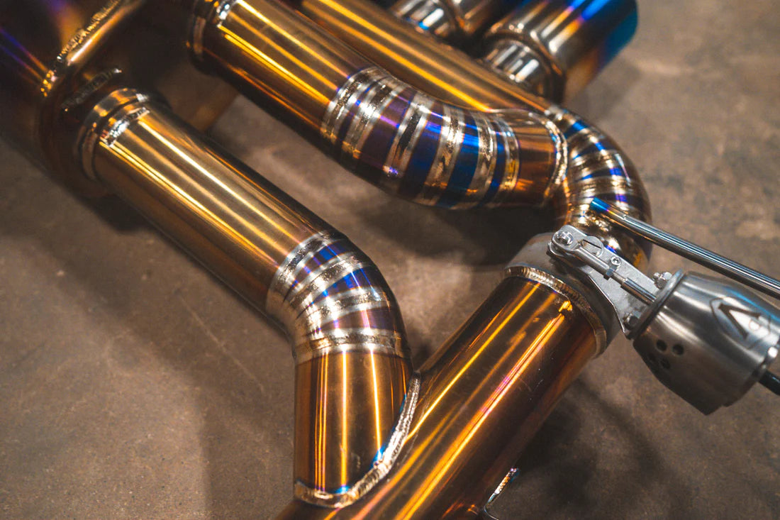 A close up of Valvetronic Designs Valved Sport Exhaust on the ground (for BMW E46 M3).