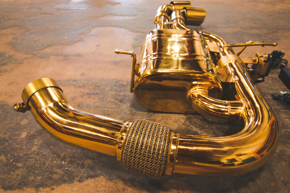 A side overview of Valvetronic Designs Valved Sport Exhaust System on the ground (for BMW i8). 