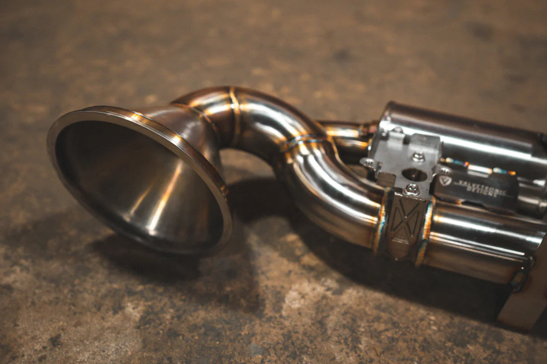 A close overview of Valvetronic Designs Valved Sport Exhaust System on the ground (for Porsche 992 GT3/ RS).