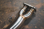 A close up view of Valvetronic Designs Valved Sport Exhaust System's pipes on the ground (for BMW X3M F97 / X4M F98).