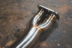 A close up view of Valvetronic Designs Valved Sport Exhaust System's pipes on the ground (for BMW X3M F97 / X4M F98).