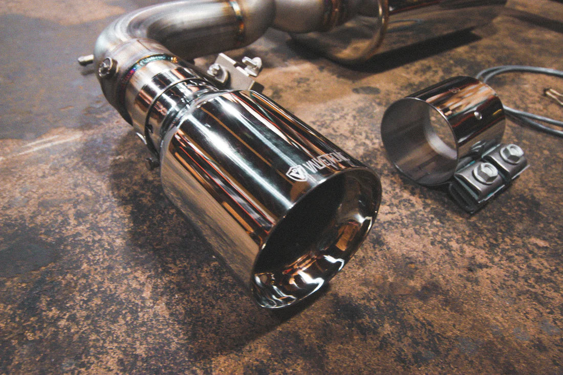 A view of Valvetronic Designs Valved Sport Exhaust System's exhaust tip in Chrome on the ground (for BMW F30 / F22 / F36 / F32). 