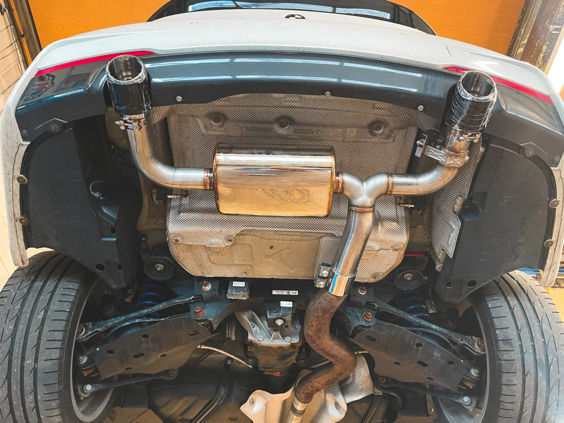 A view of Valvetronic Designs Valved Sport Exhaust System fitted on a lifted car (for BMW F30 / F22 / F36 / F32). 