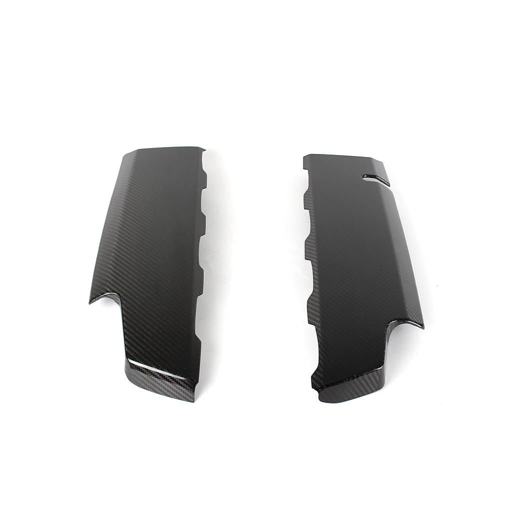 Two-piece carbon fiber engine cover panels with curved contoured shapes and visible weave pattern - APR Performance engine cover for Chevrolet Camaro SS LT1
