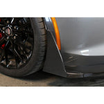 Carbon fiber front canards mounted on grey Corvette with orange side marker and black wheel visible - APR Performance front canards for Chevrolet C7 Corvette Z06
