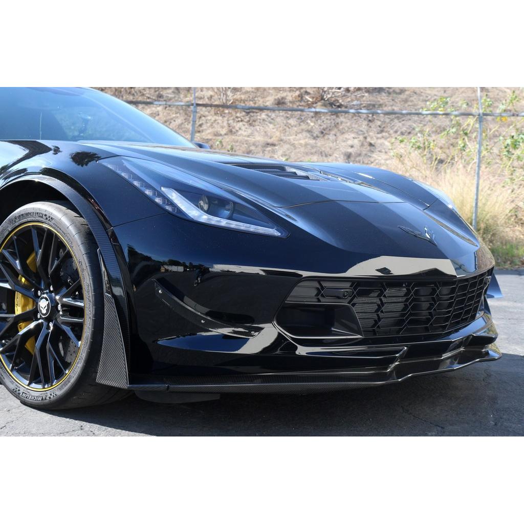 Carbon fiber front canards installed on corners of front bumper beneath headlights on dark blue Corvette - APR Performance front canards for Chevrolet C7 Corvette Z06