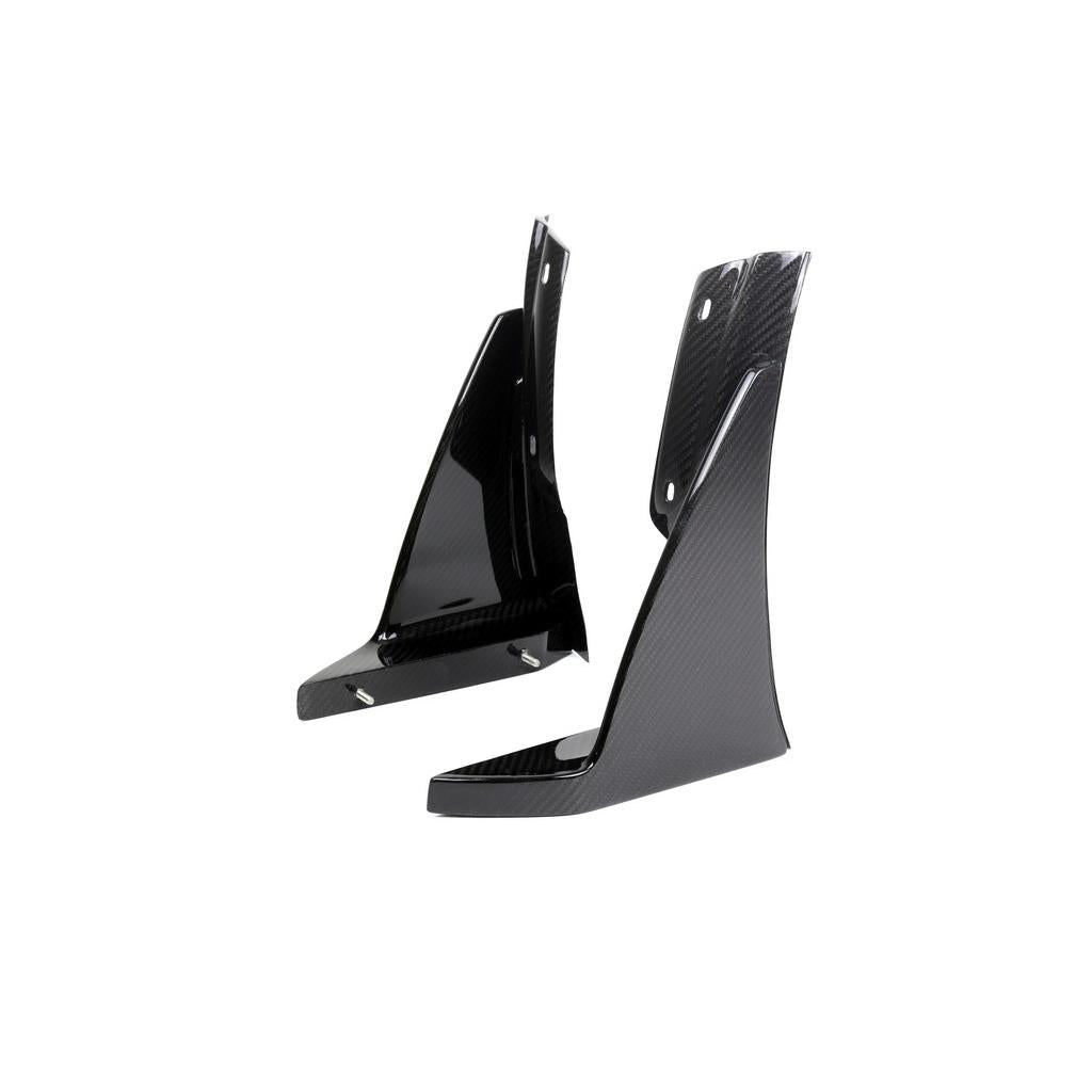 Pair of black carbon fiber triangular canards with mounting holes on clean white background - APR Performance front canards for Chevrolet C7 Corvette Z06