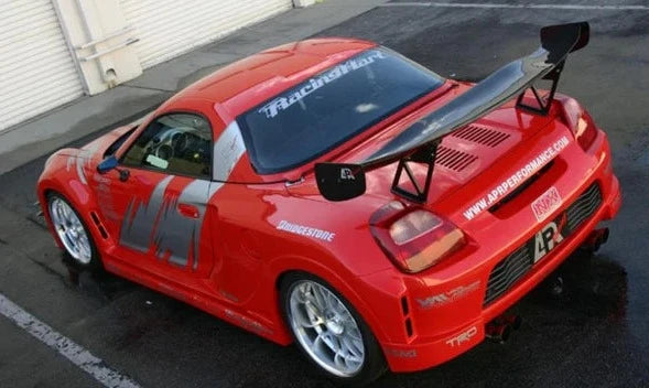 A back view of a red car fitted with APR Performance S-GT Widebody Aerodynamic Kit Toyota MR-S Spyder 2000-2005