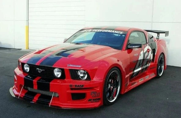 A front side wide view of a red car fitted with APR Performance GT-R Widebody Aerodynamic Kit Ford Mustang S197 2005-2009