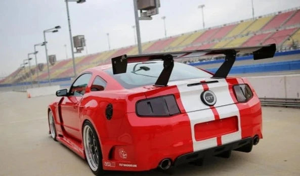 A back view of a red car fitted with APR Performance GT Widebody Aerodynamic Kit Ford Mustang 5.0 2010-2014